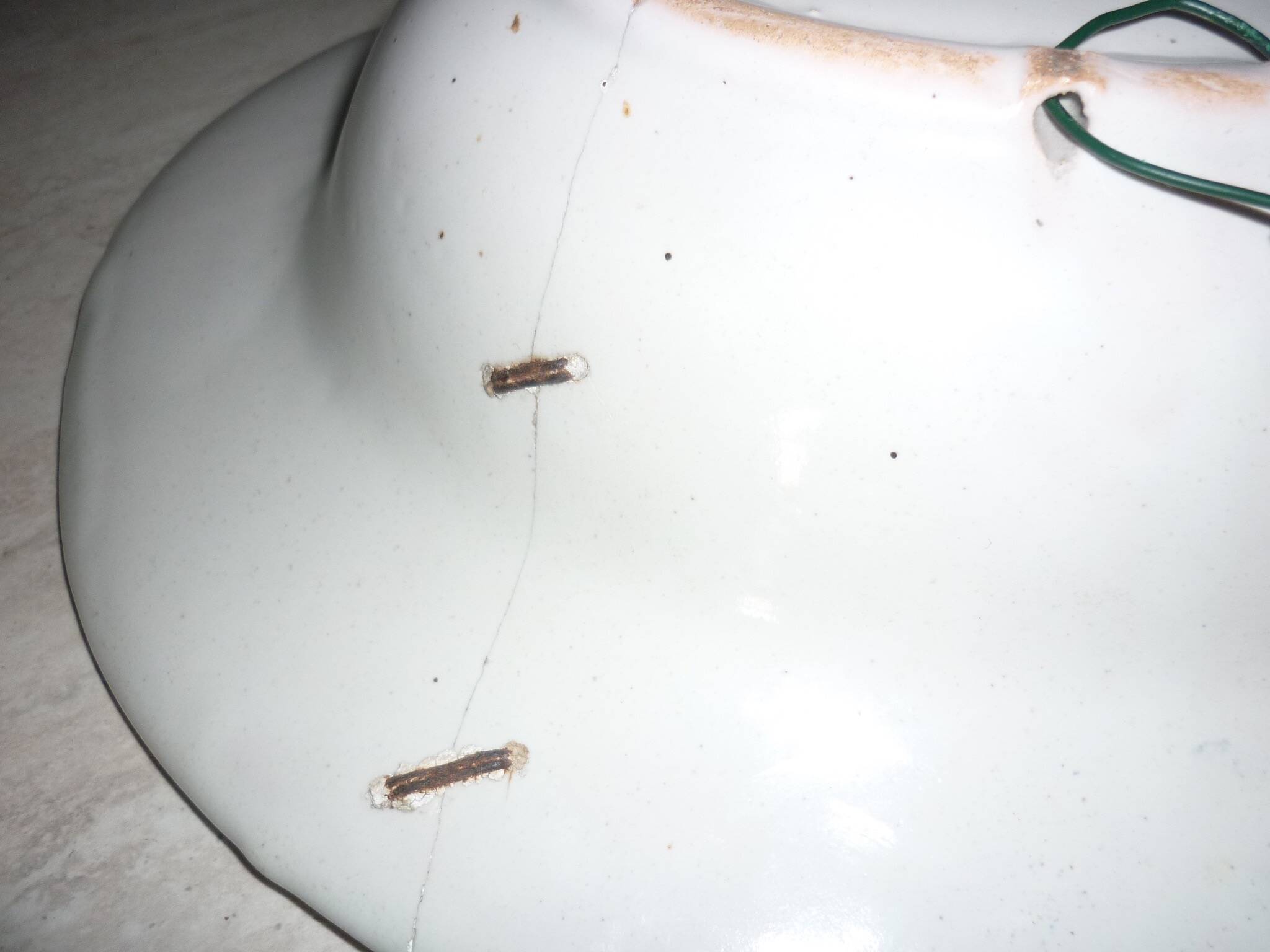 Old beard dish repair with staples