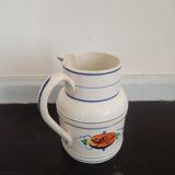 Old earthenware pourer with blue edging decoration