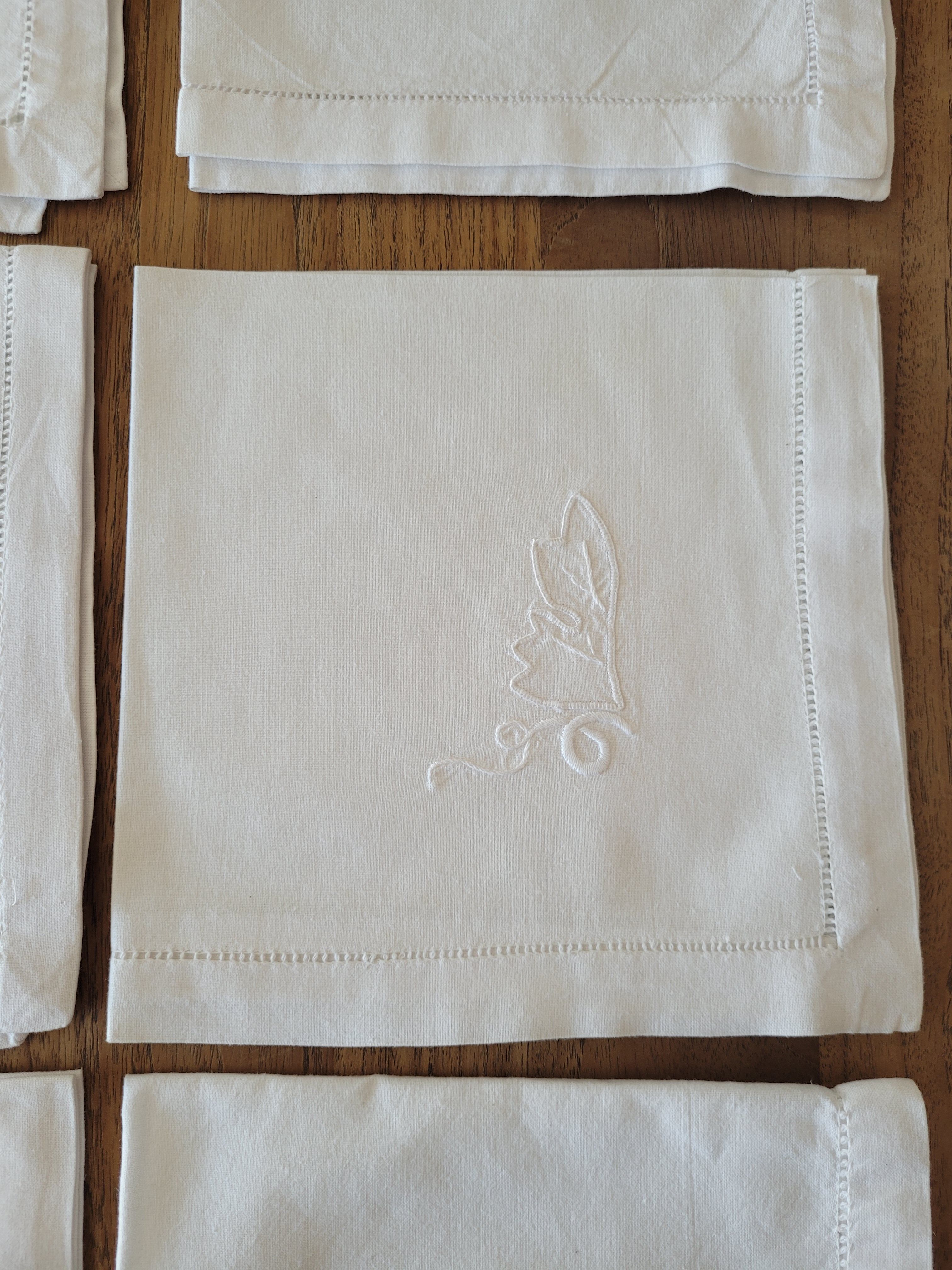 11 white embroidered towels