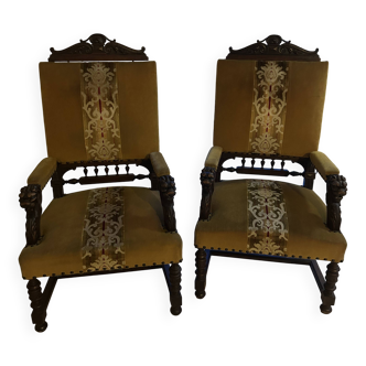 Large antique armchair/throne in carved walnut with lion heads.