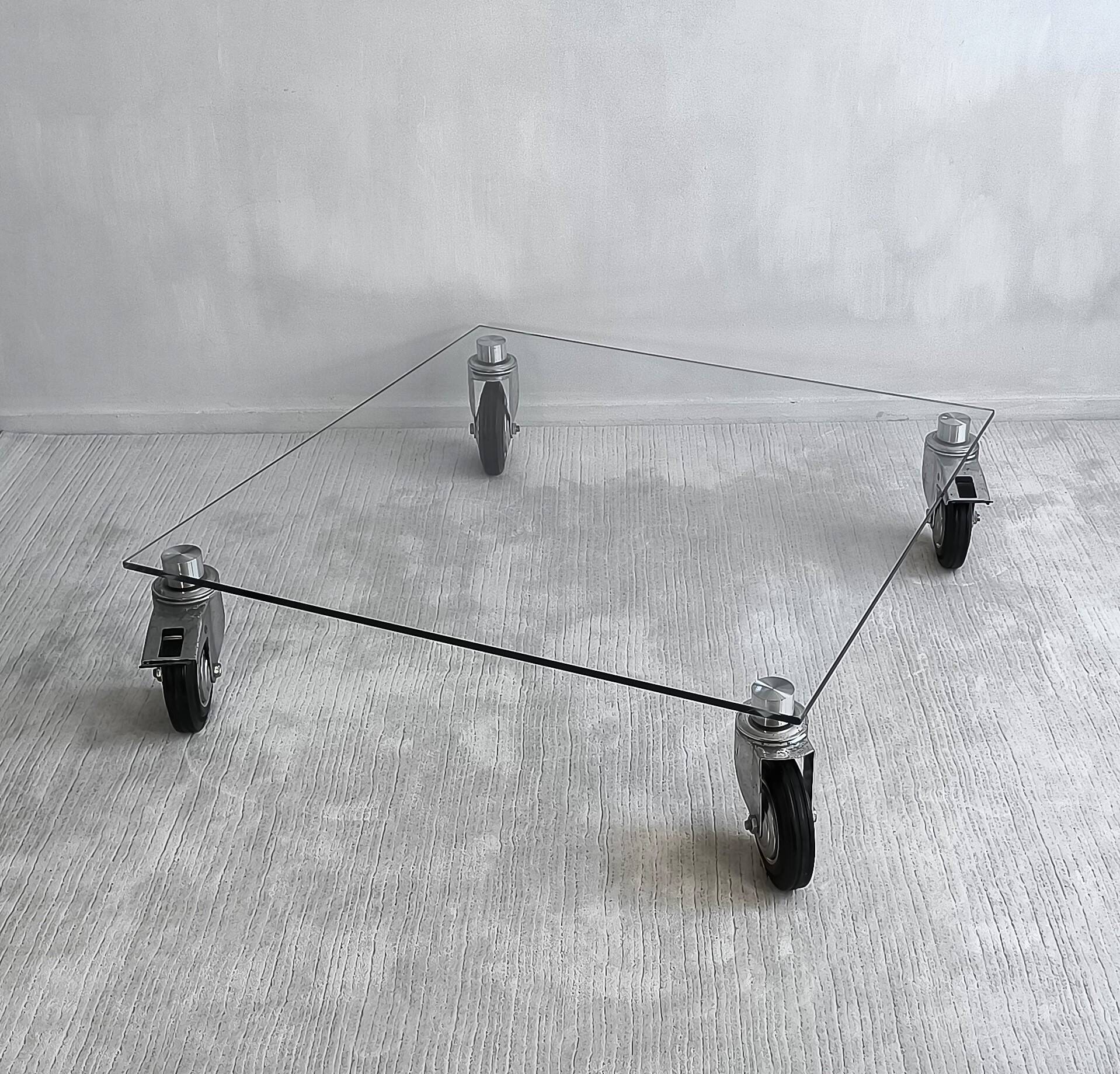 Beautiful designer glass coffee table on wheels