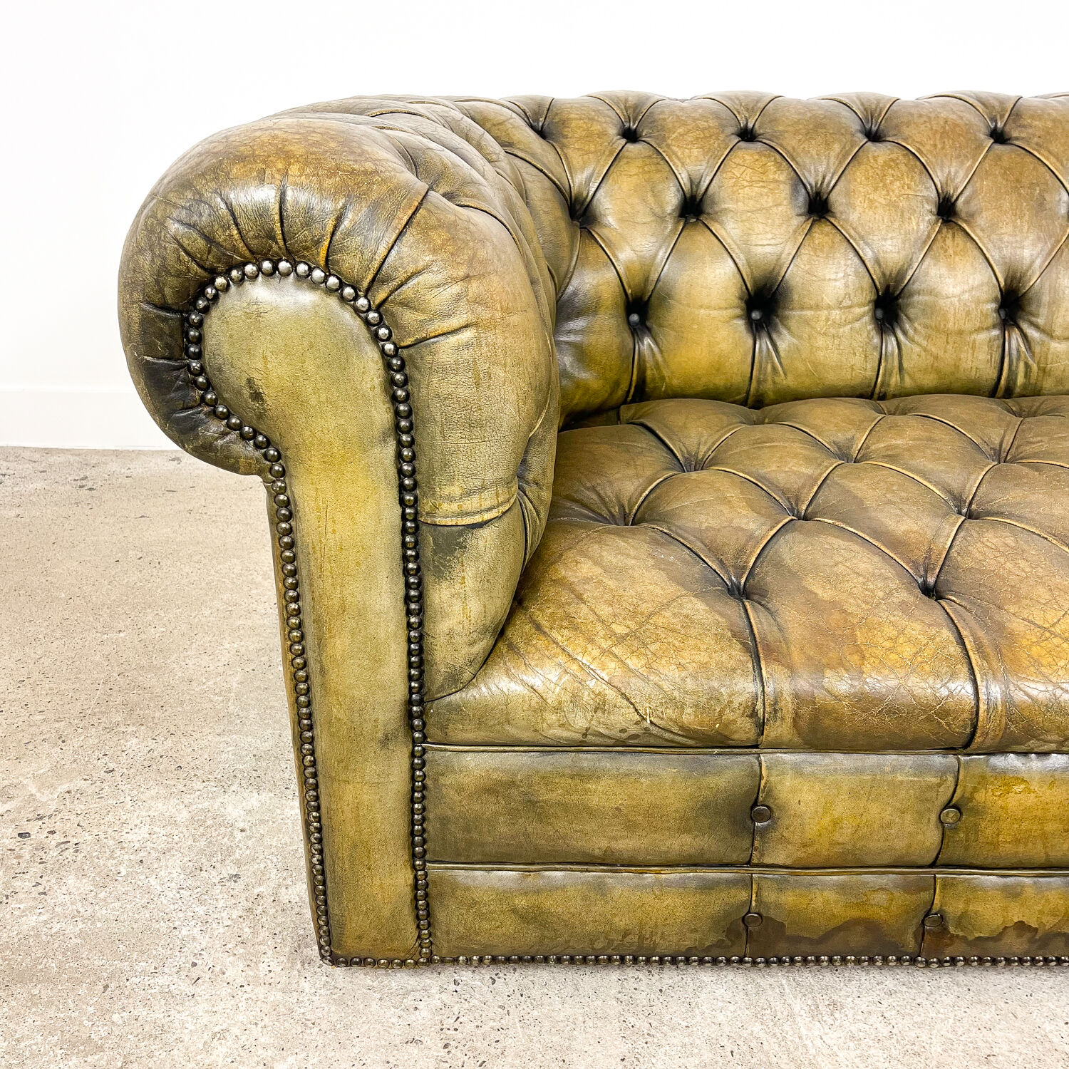 Old vintage leather chesterfield sofa
