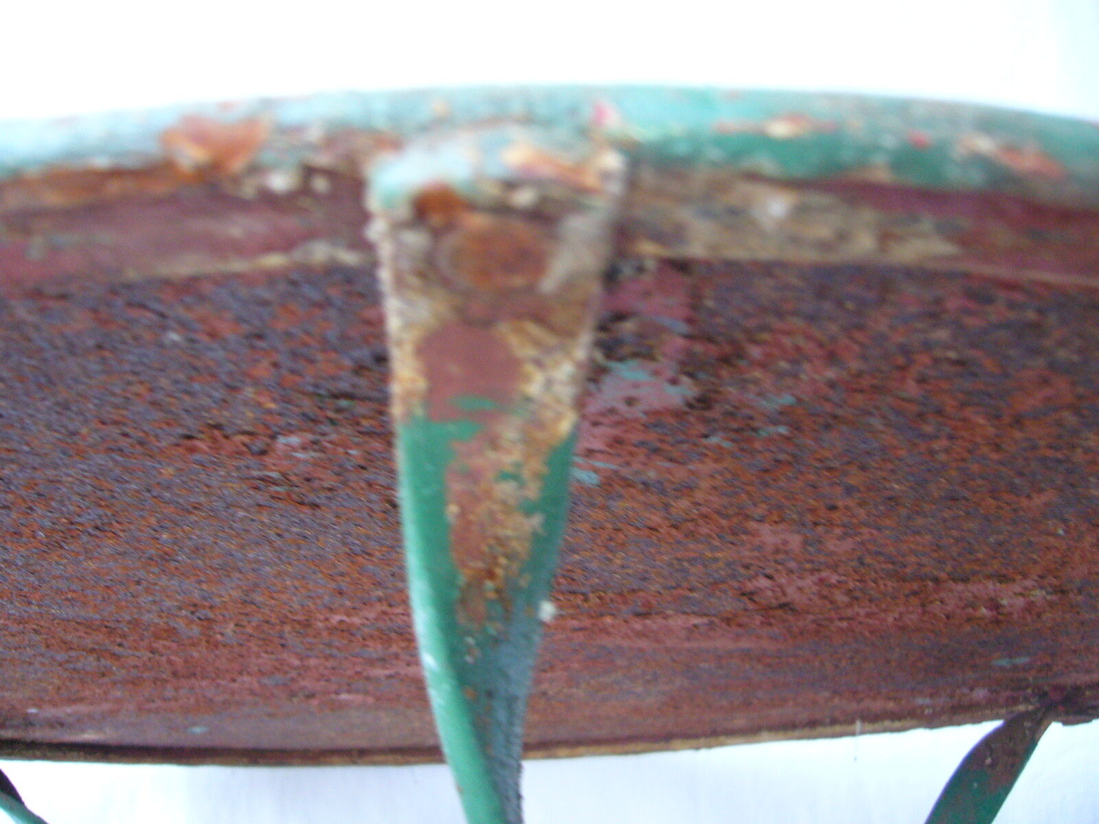 Old riveted metal garden pedestal