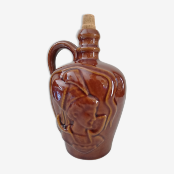 Carved ceramic bottle