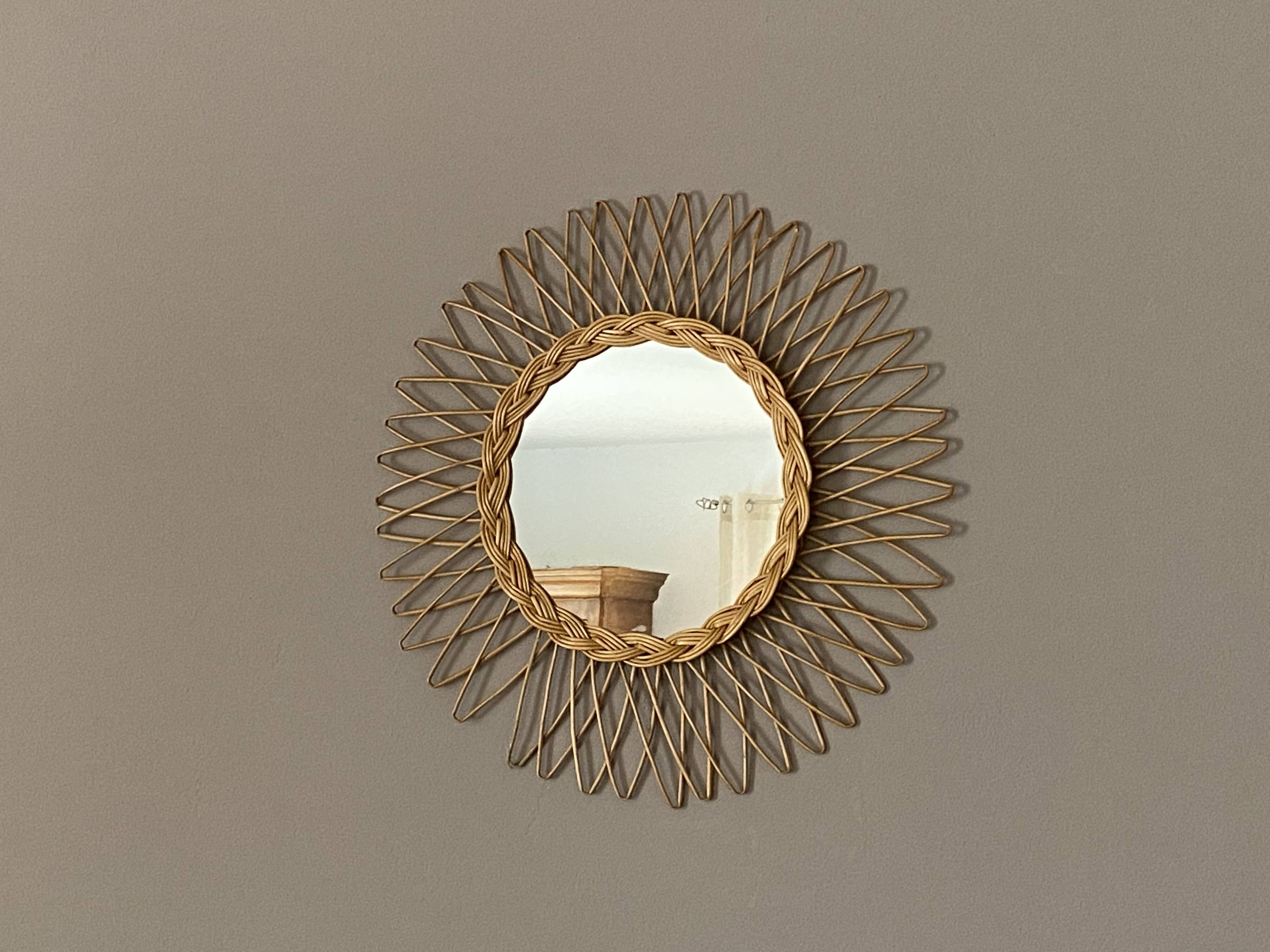 Sun mirror in woven rattan. 50cm. 1960.