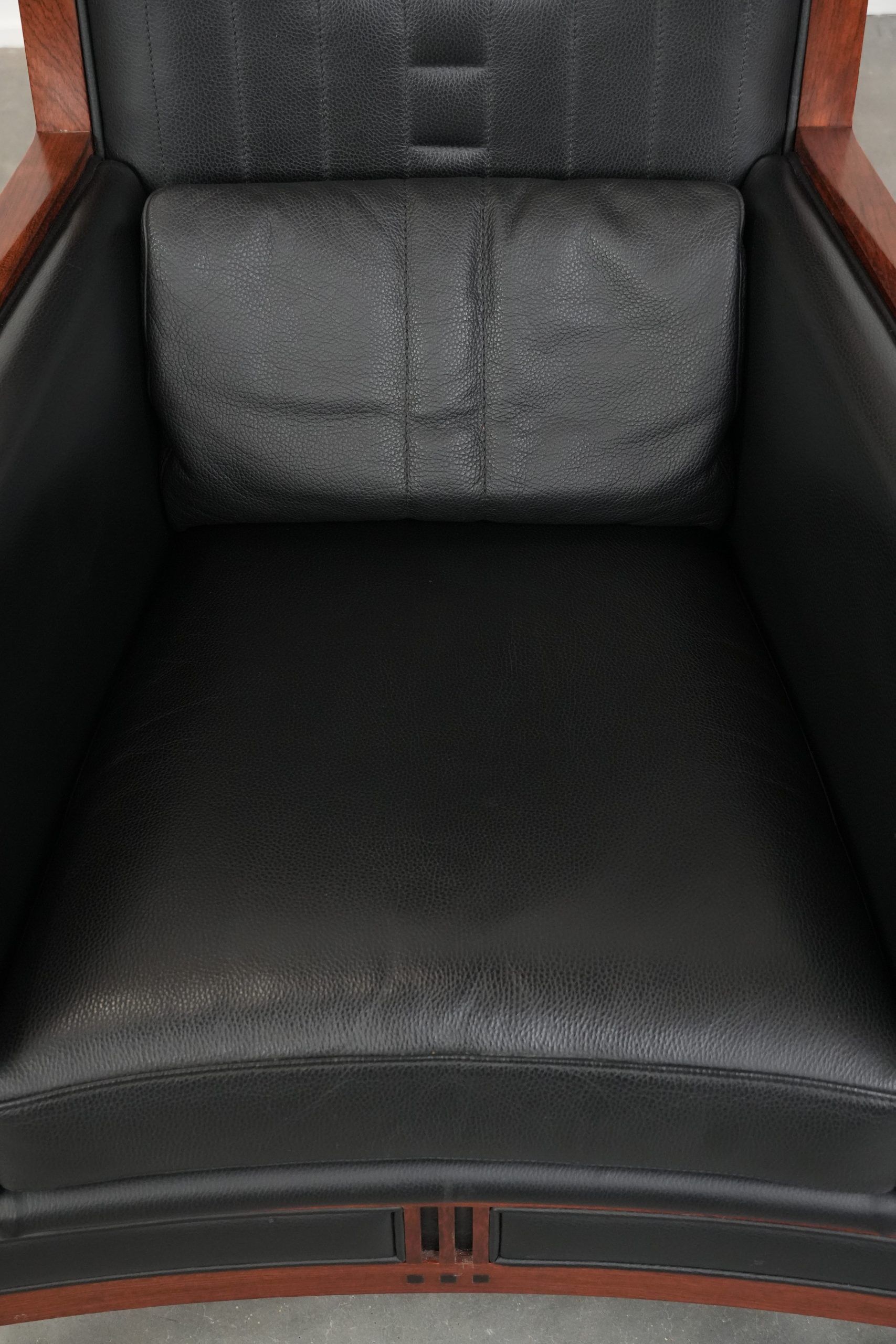 Art Deco design armchair with black leather with decorative stitching