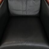 Art Deco design armchair with black leather with decorative stitching