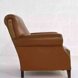 Pair of 1950s club armchairs in imitation leather and wood