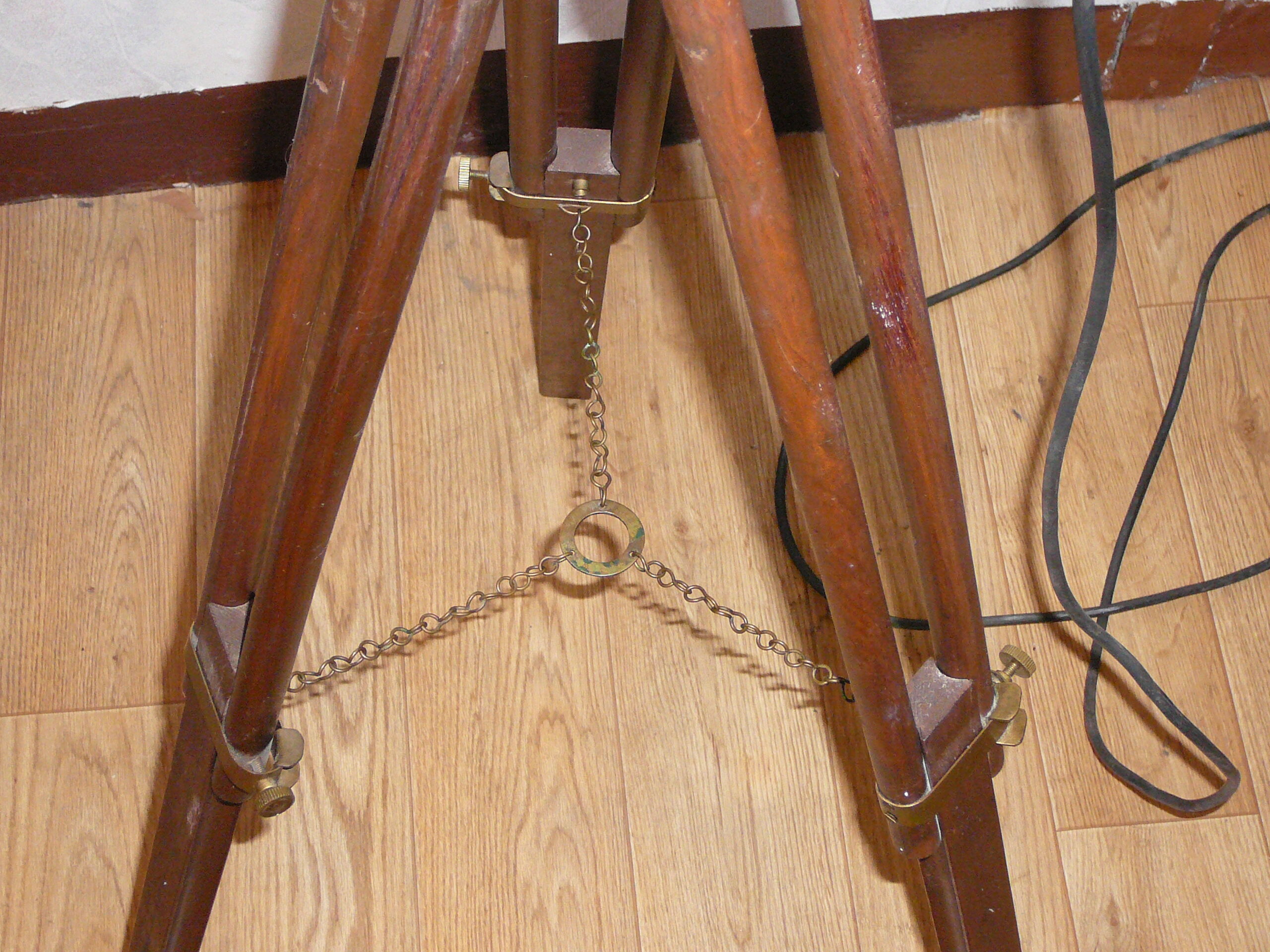 Ancient wooden tripod and brass with its indus lamp