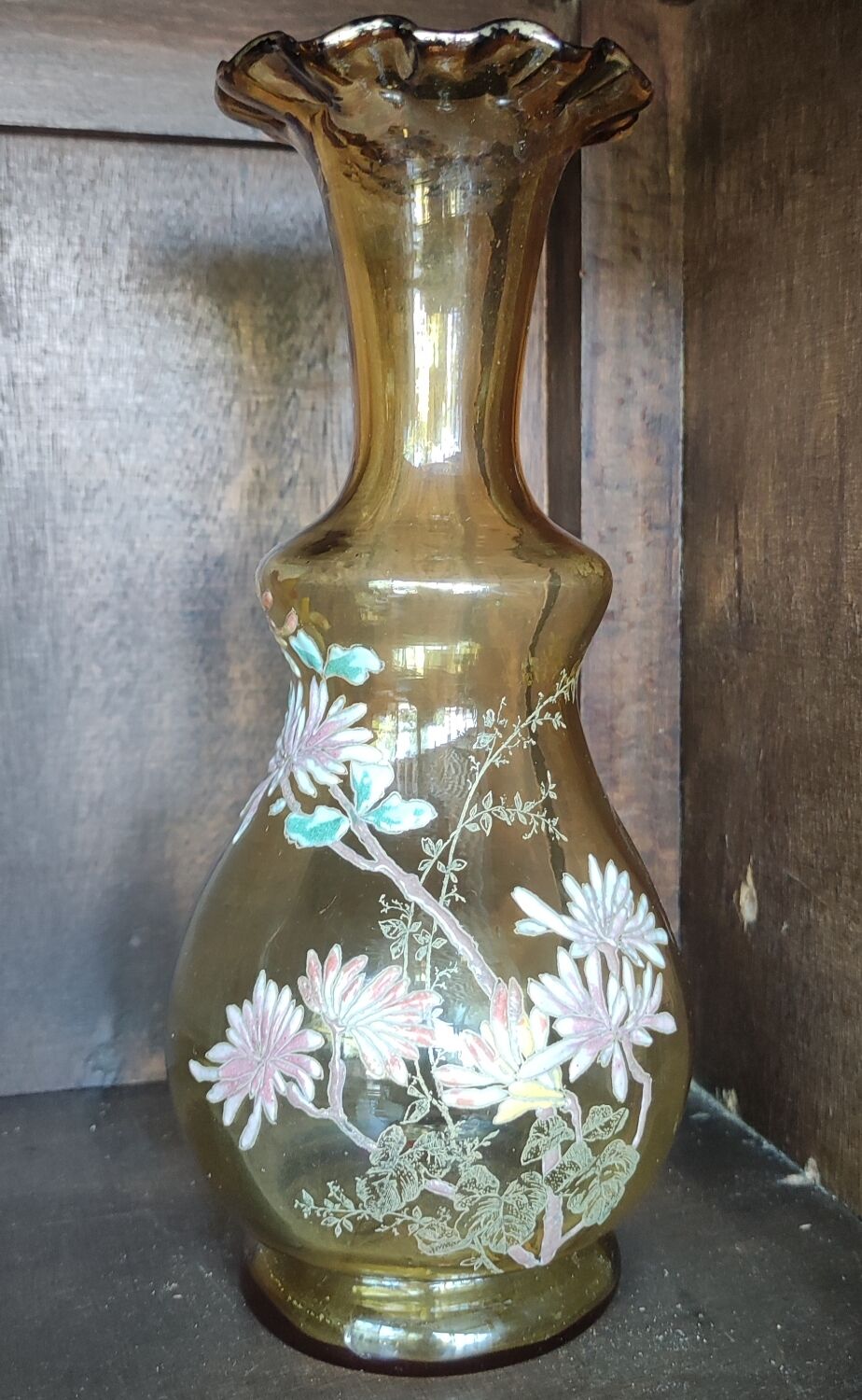 Old vase with enamelled floral decoration