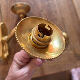 Pair of bronze wall sconces with outstretched arms and hands