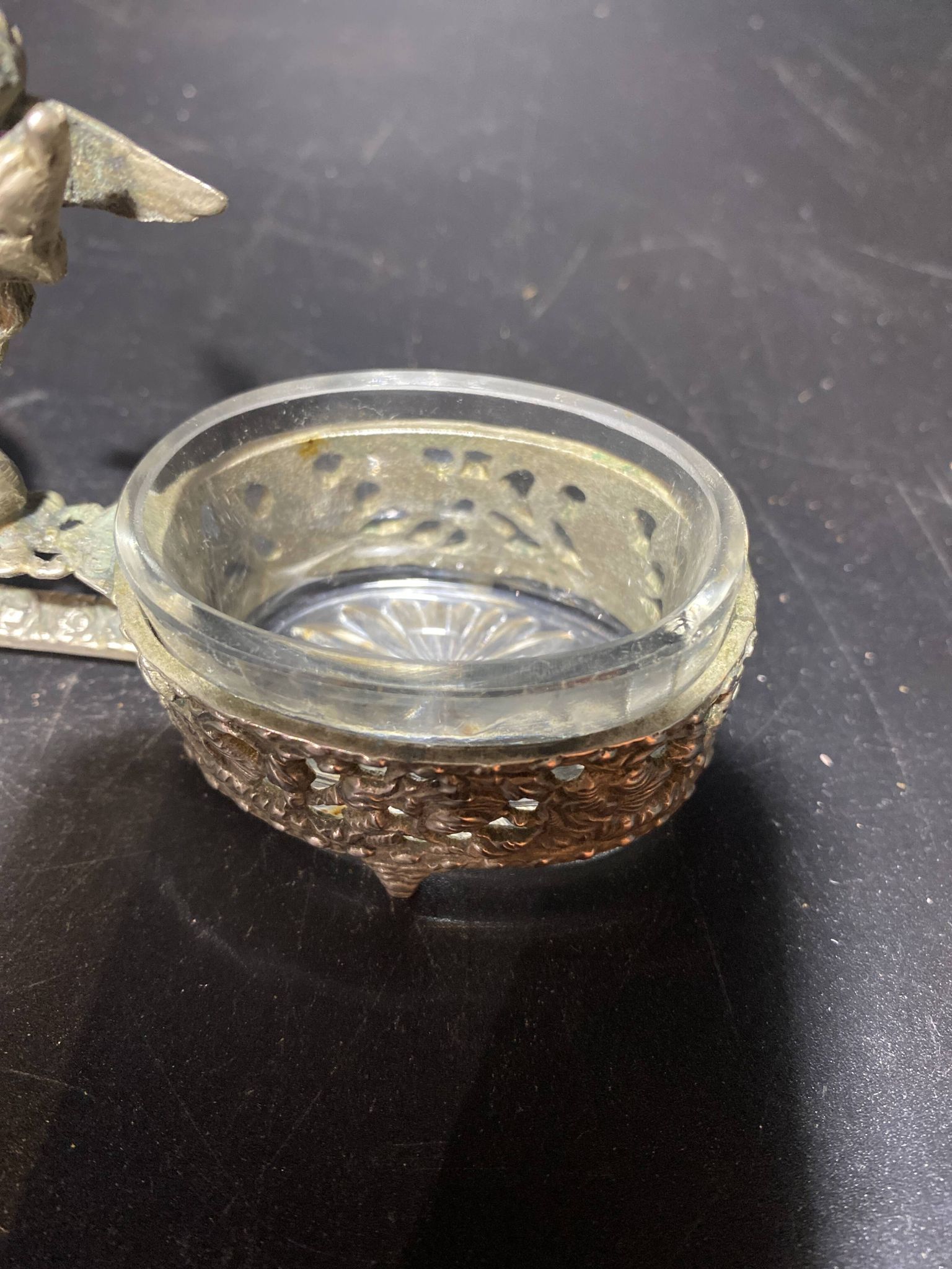 Spice centerpiece and serving spoon topped with a brass cherub
