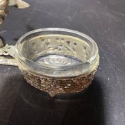 Spice centerpiece and serving spoon topped with a brass cherub