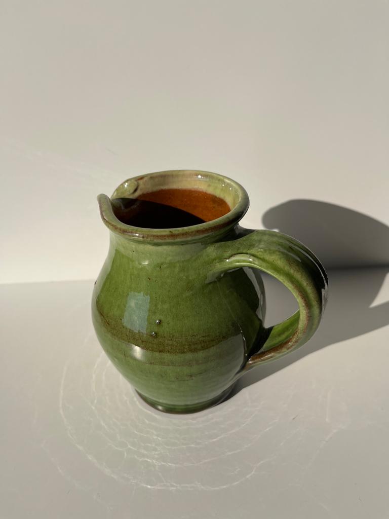 Green glazed ceramic pitcher