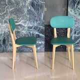 Paire de chaises vintage skaï vert pieds compas