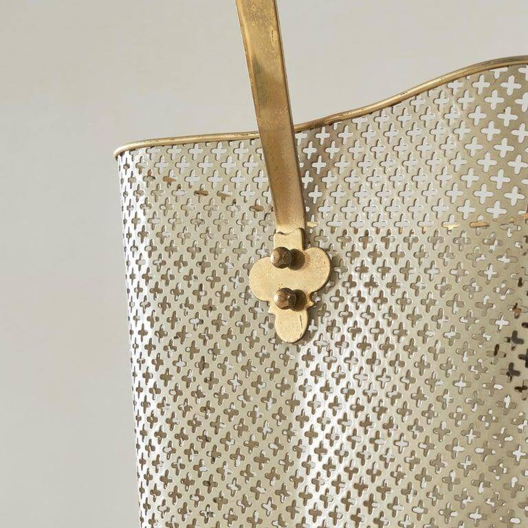 Mid-century umbrella stand in patinated brass and perforated metal, 1950s.