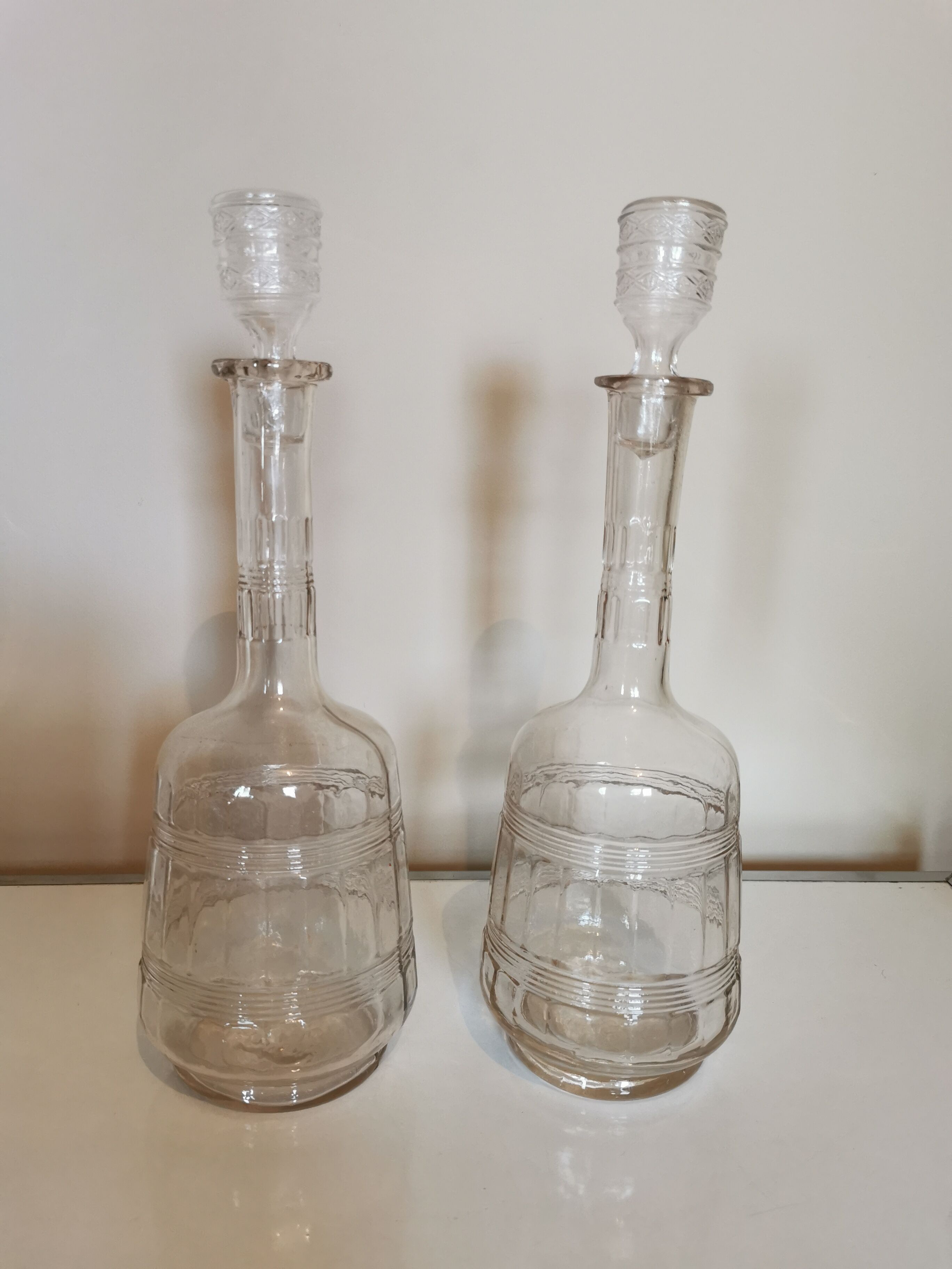 Pair of antique moulded glass decanters