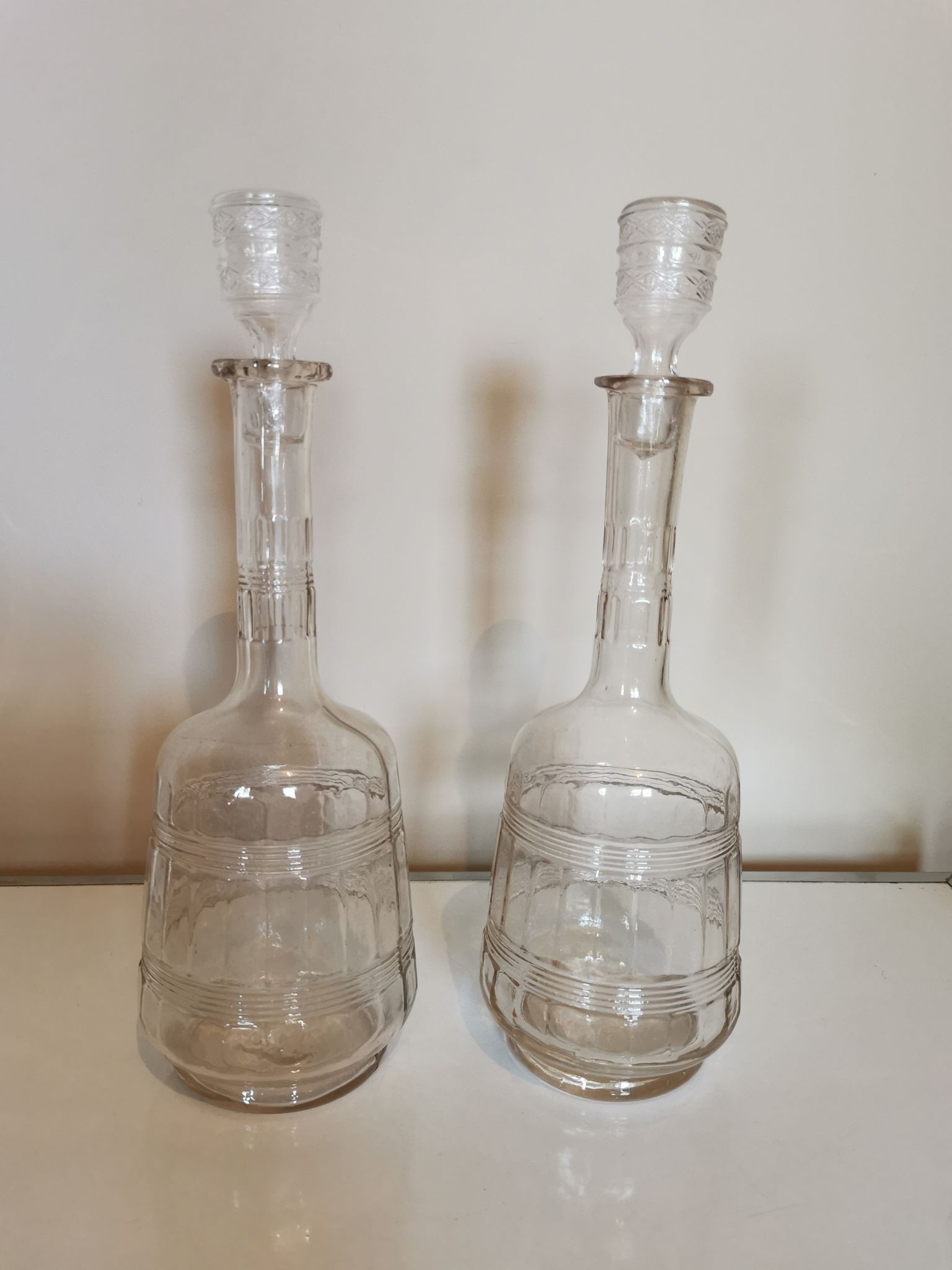 Pair of antique moulded glass carafes