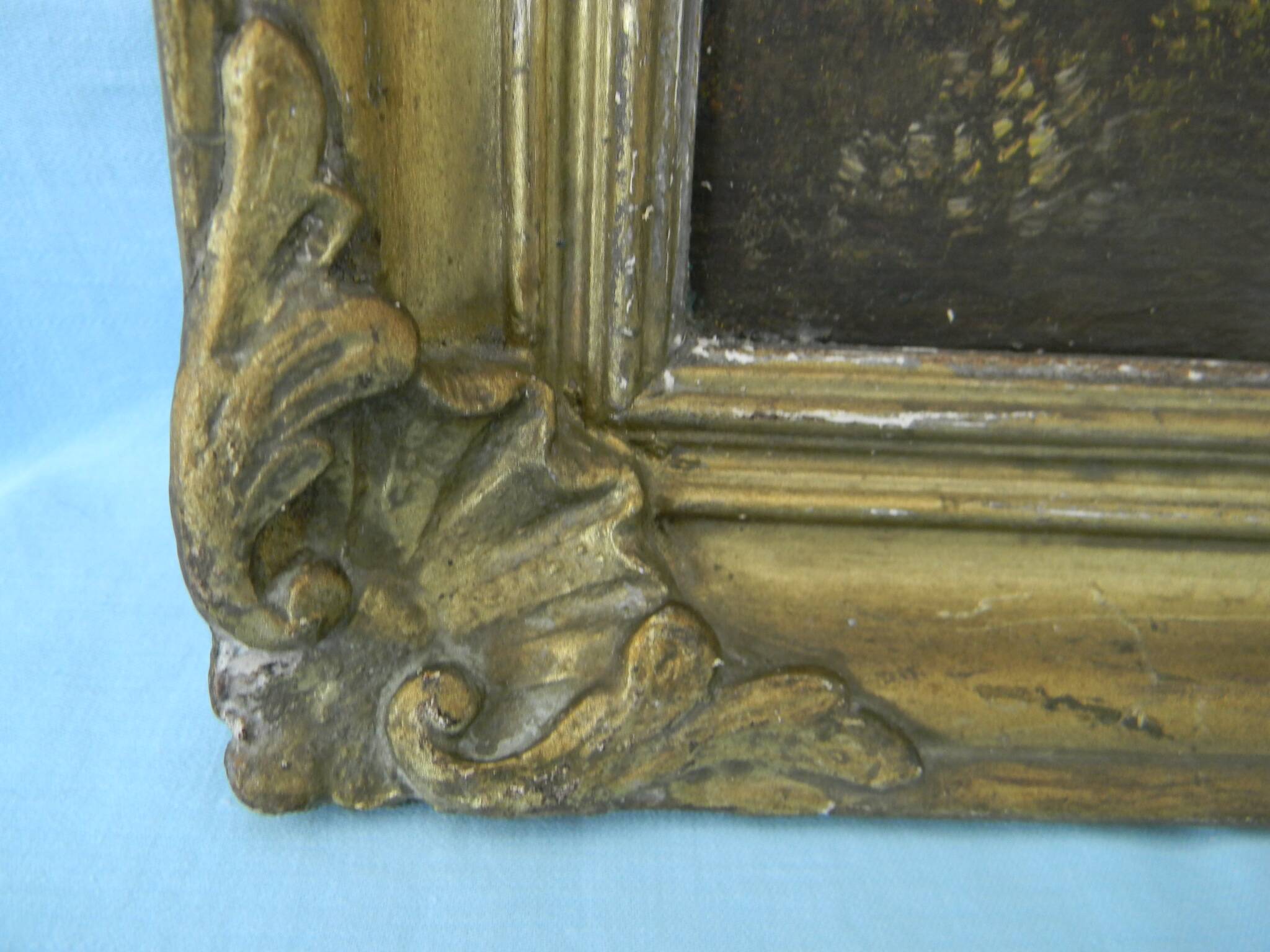 Old signed landscape painting under wood.