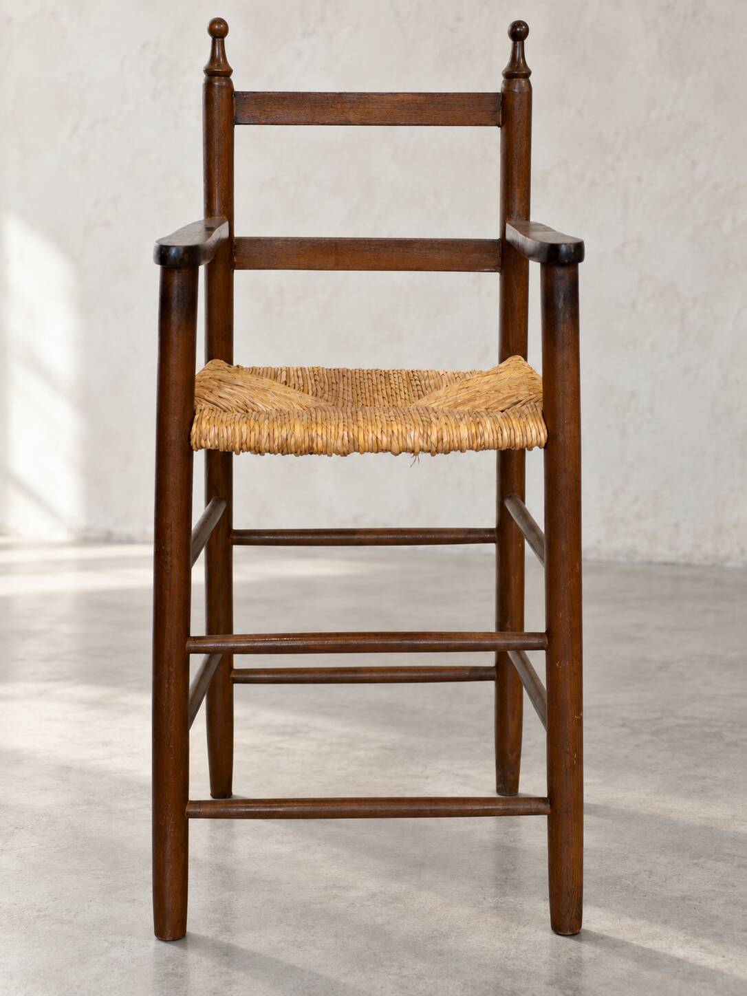 High chair made of straw and wood