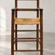 High chair made of straw and wood