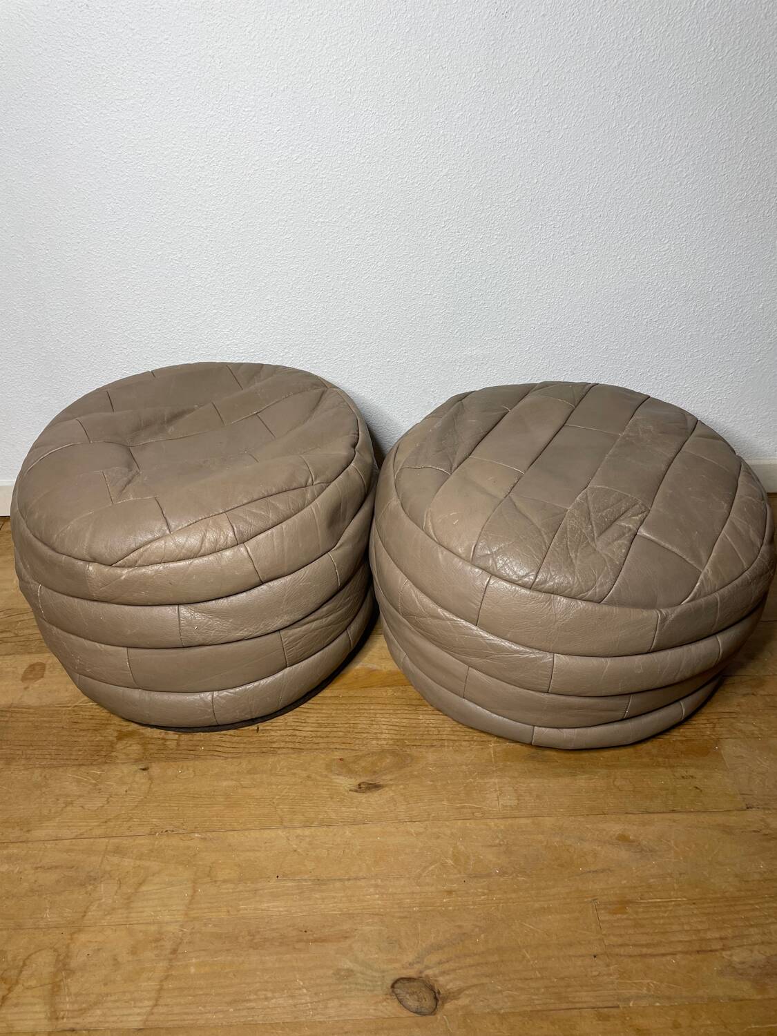Pair of De Sède patchwork leather poufs