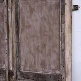 Chiseled teak door with openwork wrought iron panels