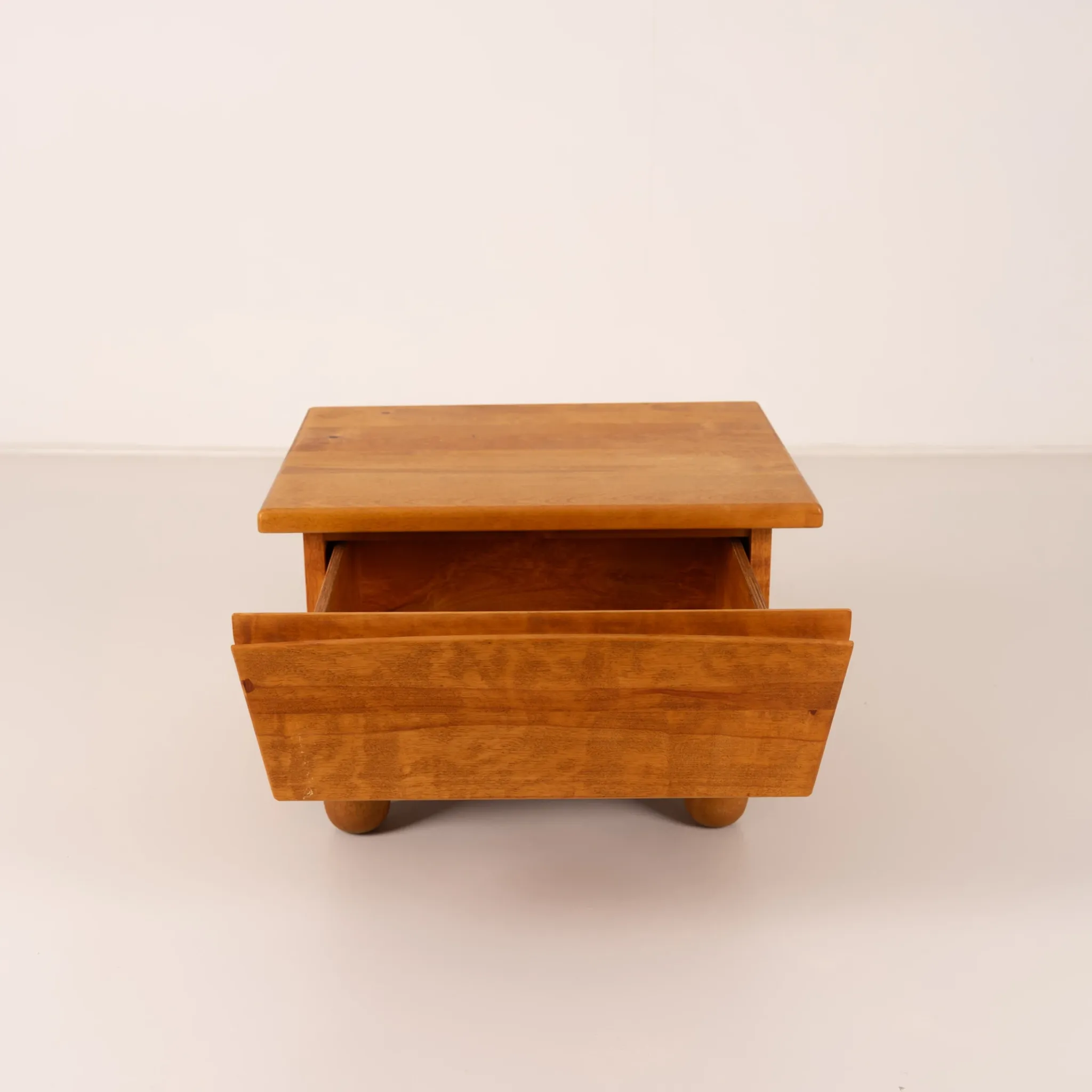 Pair of wooden bedside tables with rounded feet
