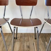Trio of chairs in light brown formica and cream contour 70s