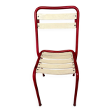Red and white Tolix chair