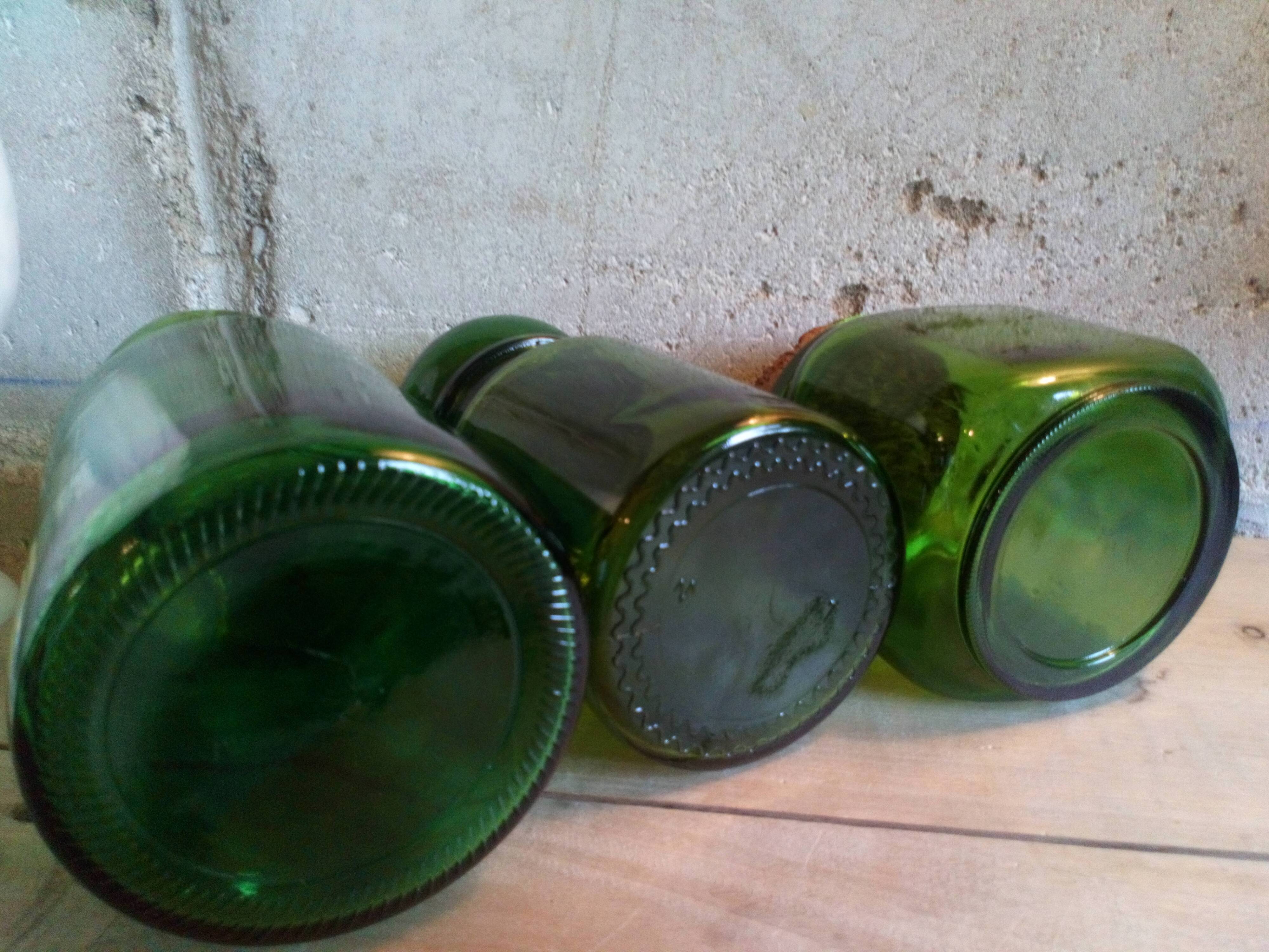 Trio of green glass apothecary bottles