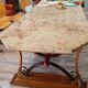 Large polished granite dining table on an oak and iron base.