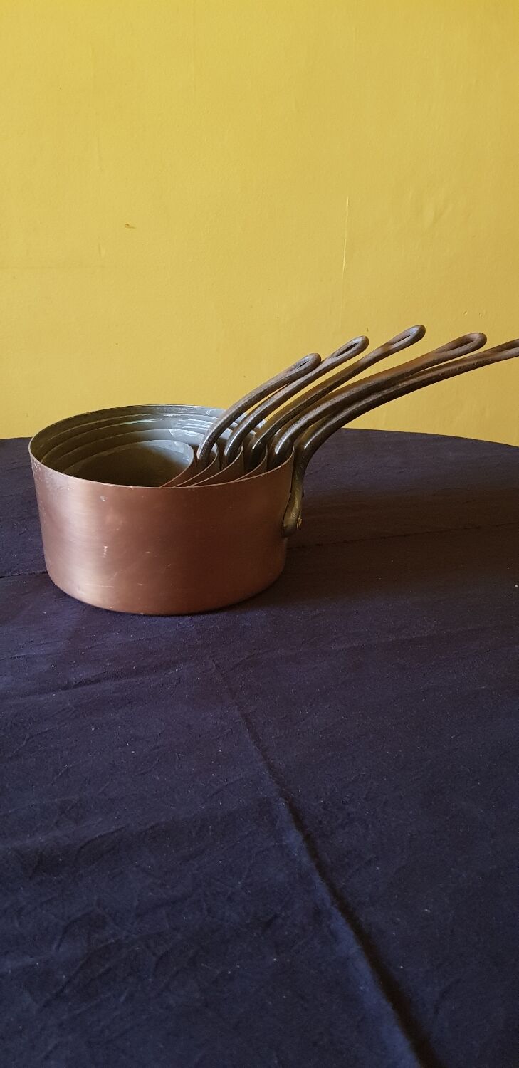 Series of 5 tinned copper saucepans. Great height.