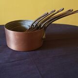 Series of 5 tinned copper saucepans. Great height.