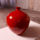 Vase rouge en céramique émaillée