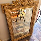 Old gilded mirror with pediment