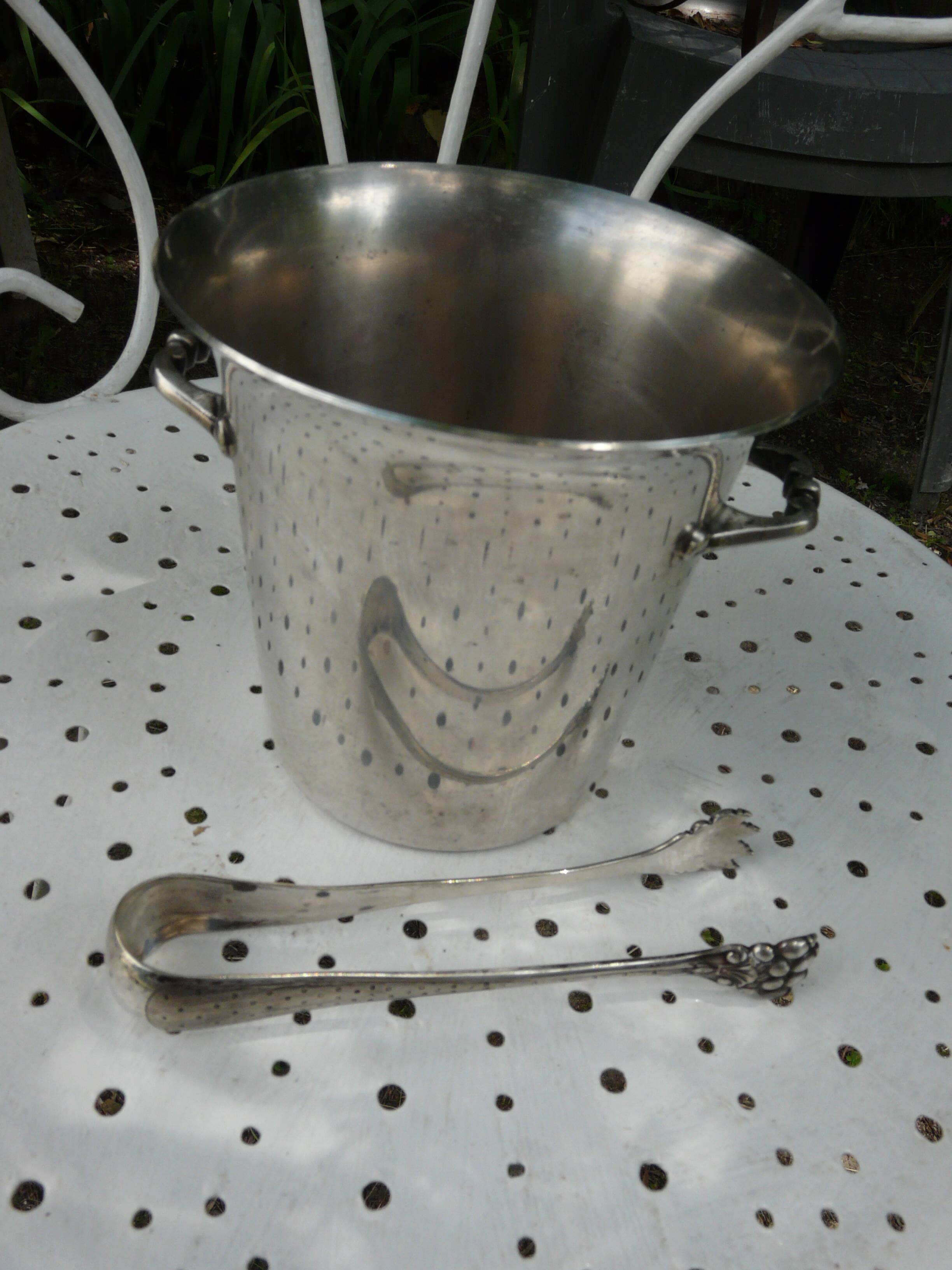 Silver metal ice bucket with its lion's pate tongs