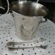 Silver metal ice bucket with its lion's pate tongs