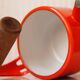 Kobenstyle Jens Quistgaard kettle in enameled metal & solid wood