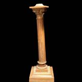 Bronze candle holder with floral motifs.