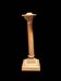 Bronze candle holder with floral motifs.