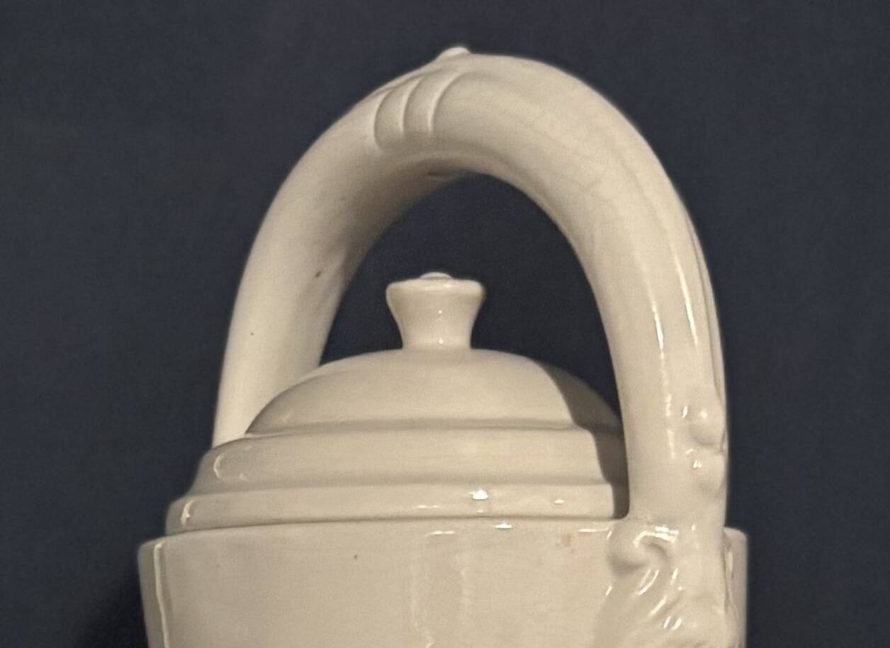 Large white faience jug with a satyr head spout, 19th century.