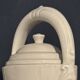 Large white faience jug with a satyr head spout, 19th century.
