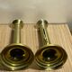 Duo of brass push candle holders