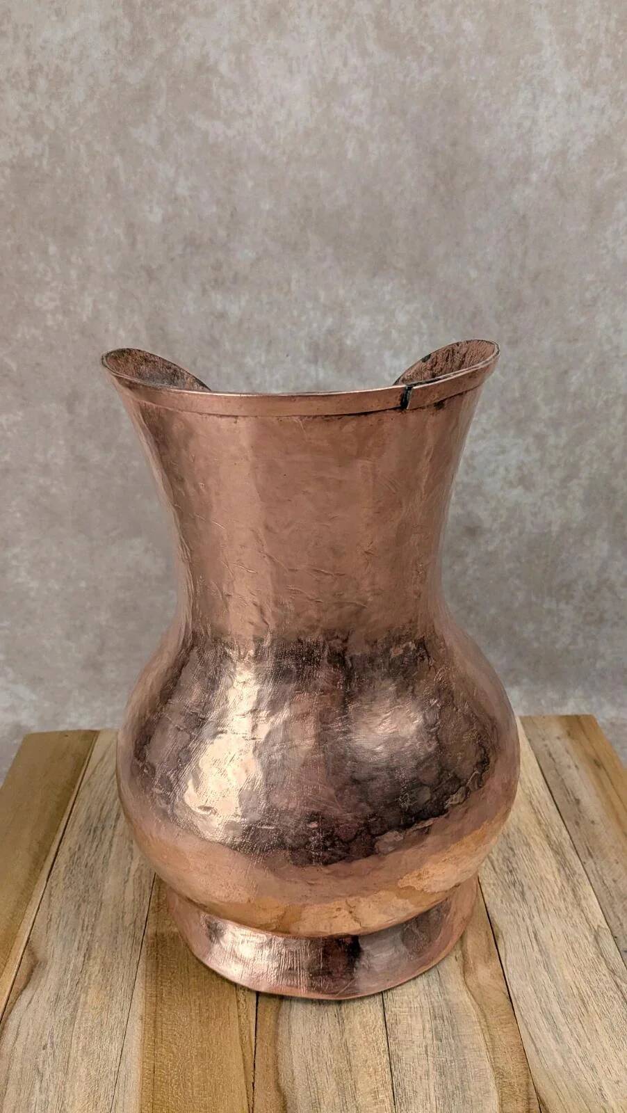 Antique hammered copper jug