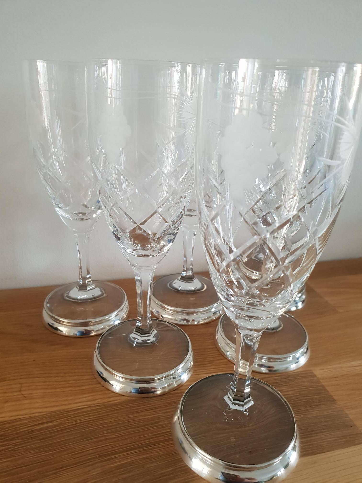 Crystal flutes with a silver rimmed foot