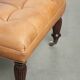 Sheepskin ottoman/coffee table on wheels in English chesterfield style