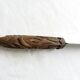 Old bread knife with a carved wooden handle