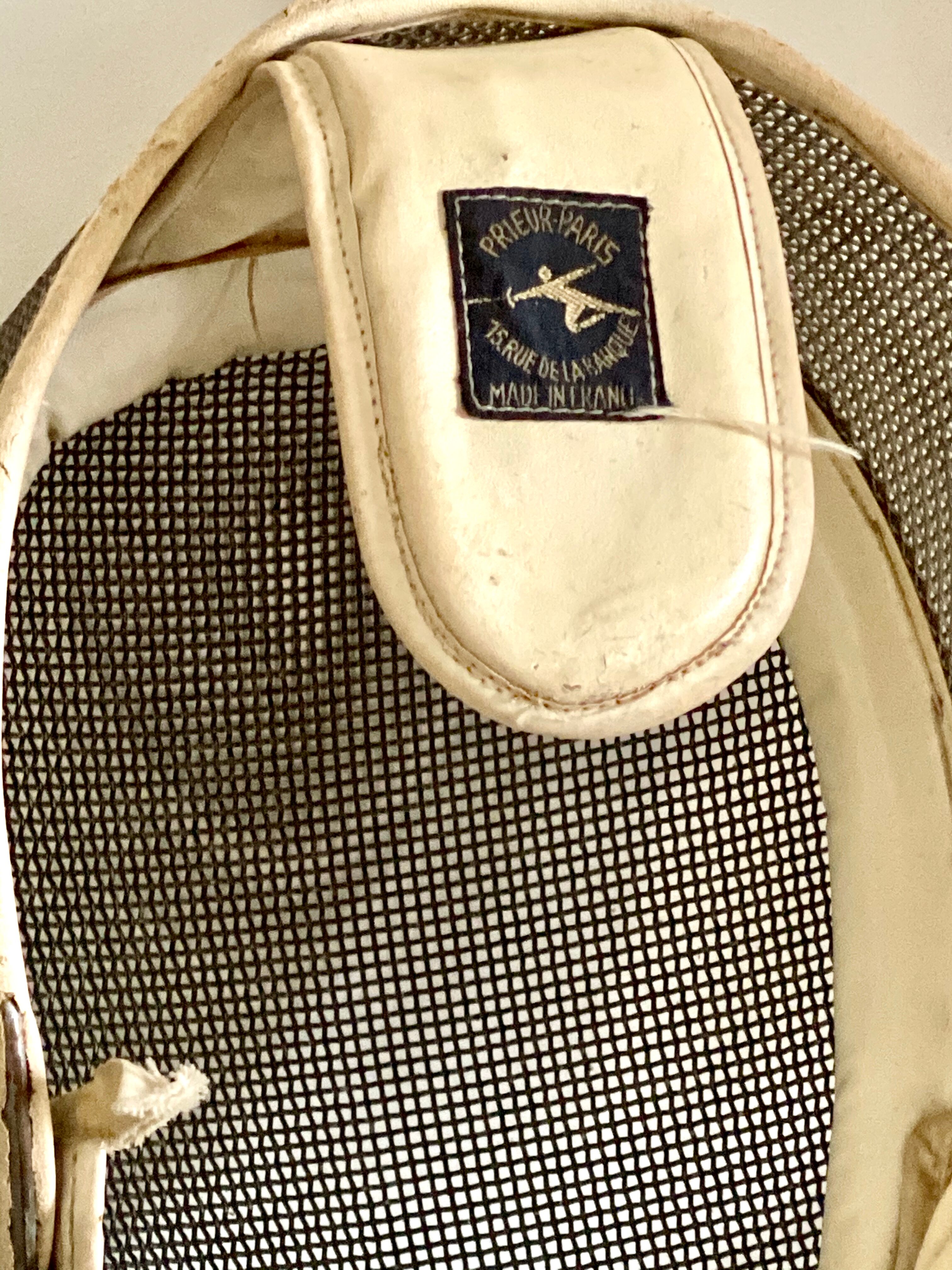 Old fencing mask set and its foil