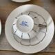 White and silver Limoges porcelain coffee cups and saucers.